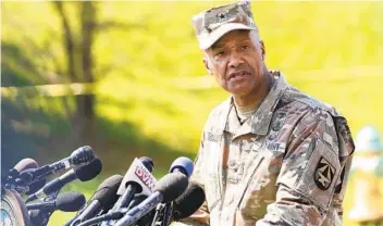  ?? CAROLYN KASTER AP ?? Brig. Gen. Michael J. Talley, commander of U.S. Army Medical Research and Developmen­t Command Fort Detrick, Md., speaks during a news conference near the scene of a shooting Tuesday.