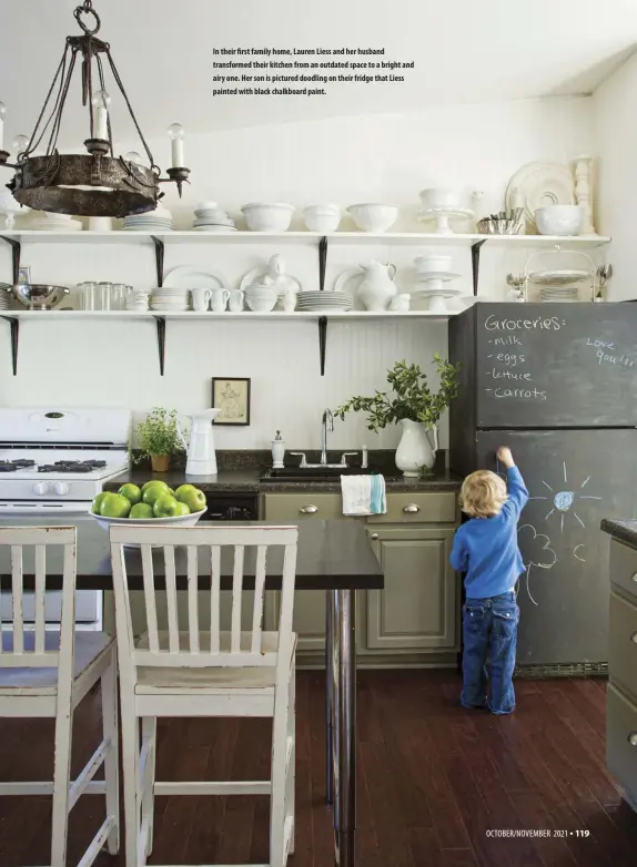 ??  ?? In their first family home, Lauren Liess and her husband transforme­d their kitchen from an outdated space to a bright and airy one. Her son is pictured doodling on their fridge that Liess painted with black chalkboard paint.