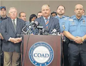  ?? [BRIAN WITTE/THE ASSOCIATED PRESS] ?? Geoffrey Klopp, center, president of the Correction­al Officers Associatio­n of Delaware, speaks about a prison uprising Thursday in Dover, Del. Klopp says that he believes the uprising was due to low staffing issues at the 2,500-prisoner James T. Vaughn...