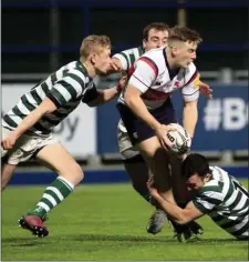  ??  ?? Ryan O’Loughlin puts in a tackle supported by Killian Marmion and Dylan Simmonds.