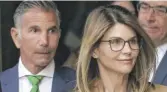  ?? STEVEN SENNE/AP ?? Lori Loughlin and husband, clothing designer Mossimo Giannulli, in 2019.