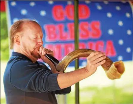  ?? PETE BANNAN — DIGITAL FIRST MEDIA ?? Thursday was the National Day of Prayer and a local service was held at Rose Tree Park. David Buffum of Congregati­on Beth Yeshua in Overbrook Park blew the shofar for a call to prayer and worship.