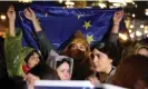  ?? Zurab Tsertsvadz­e/AP ?? The crowd on Saturday waved Georgian, EU and some Ukrainian flags. Photograph: