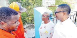  ?? ?? Ingrid Lachish speaks with PNP President Mark Golding (second left), Phillip Paulwell (right), member of parliament for East Kingston and Port Royal, and Shawn McGregor, candidate for the Rae Town division.