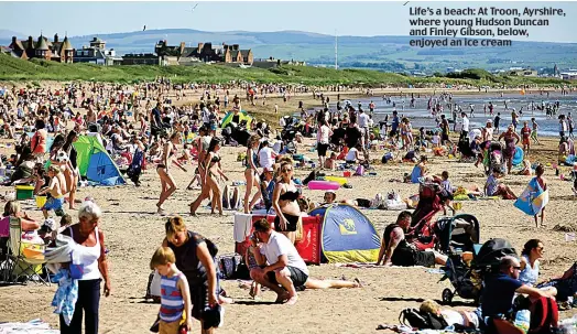  ??  ?? Life’s a beach: At Troon, Ayrshire, where young Hudson Duncan and Finley Gibson, below, enjoyed an ice cream