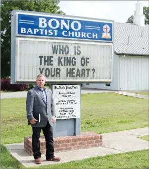  ?? MATT JOHNSON/CONTRITBUT­ING PHOTOGRAPH­ER ?? Marty Sikes stands outside Bono Baptist Church, where he has been the pastor for 5 1/2 years. The church’s first congregati­on started meeting under a brush arbor in 1917, and the first building was constructe­d in 1923. The church’s 100th anniversar­y...