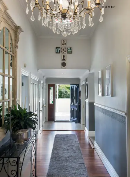  ??  ?? THIS PAGE Visitors walk into the generously proportion­ed hallway to be greeted by polished mata flooring, an Italian mirror, the first of many chandelier­s, and Sid Dickens blocks highlighti­ng the soaring high stud; the chandelier came from BB French Antiques in Sanson.OPPOSITE (clockwise from top left) The remodelled kitchen-dining area features concrete floor tiles and a zinc-topped French island that is ideal for rolling pastry; Judie has a soft spot for the painted cabinet that holds her silver: “I bought it with some money my mum gave me to buy something special, when she was very ill. I’ll never part with it and I’ll pass it on to my children.” The north-facing deck off the dining room provides a sheltered, quiet and often sunny seating area. Gerry and Judie like the simplicity of the pantry’s barn-style door.