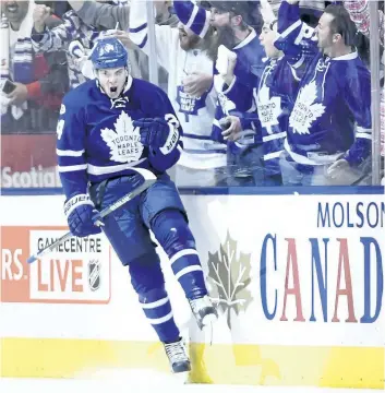  ?? NATHAN DENETTE/THE CANADIAN PRESS ?? Toronto Maple Leafs’ centre Auston Matthews celebrates after scoring against the Washington Capitals during the third period of Game 6 of their Stanley Cup hockey first-round playoff series, in Toronto on Sunday.