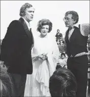  ??  ?? MAGGIE SMITH, with “California Suite” director Herbert Ross, right, and actor Michael Caine.