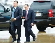  ?? THE ASSOCIATED PRESS ?? White House Director of Social Media Dan Scavino, left, walks with former White House Chief of Staff Reince Priebus as they arrive Friday at Andrews Air Force Base, Md.