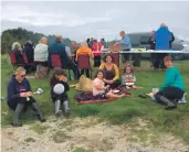  ??  ?? Gigha residents gathered on Ministers Beach for the fundraiser.