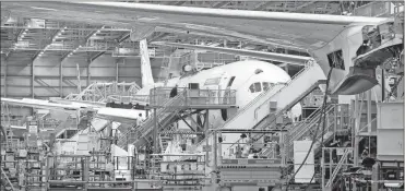  ?? Mike Siegel/Seattle Times/TNS ?? Boeing 787s in different stages of completion, in the final assembly line in Everett, Wash., on Jan. 15, 2019.