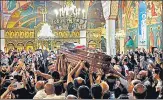  ?? AFP ?? Palestinia­n mourners wave national flags as they carry the casket of Shireen Abu Aklel inside a church, in Jerusalem,