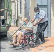  ?? AP ?? Mehul Choksi is taken to a police van by an officer after attending a court hearing in Roseau, Dominica.