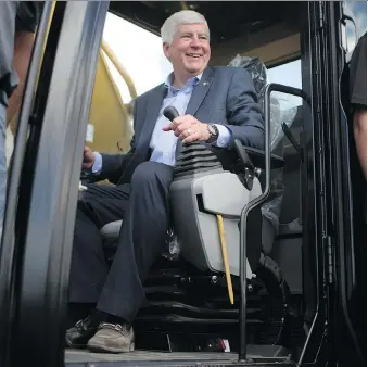 ?? DAX MELMER ?? Michigan Governor Rick Snyder in an excavator Tuesday during the groundbrea­king ceremony for constructi­on on the Gordie Howe Internatio­nal Bridge in Detroit.
