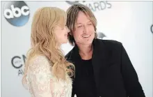  ?? EVAN AGOSTINI THE ASSOCIATED PRESS ?? Nicole Kidman, left, added backing vocals to “Female” and is the inspiratio­n for two other songs on Keith Urban’s latest album.