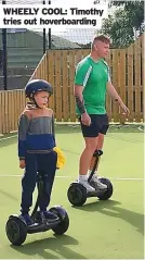  ?? ?? WHEELY COOL: Timothy tries out hoverboard­ing