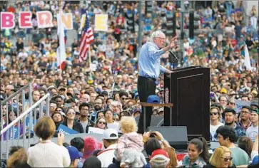  ?? Luis Sinco Los Angeles Times ?? BERNIE SANDERS draws crowds of 10,000 or more to his rallies, including this one in L.A. last month.