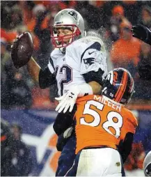  ?? Jack Dempsey / Associated Press ?? Patriots quarterbac­k Tom Brady is sacked by Denver outside linebacker Von Miller on Nov. 29.