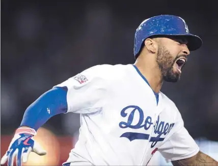  ?? Wally Skalij Los Angeles Times ?? MATT KEMP expresses what many Dodgers fans no doubt felt, letting out a roar after hitting a home run off St. Louis’ Pat Neshek in the eighth inning. It gave L. A. a 3- 2 lead, after the Cardinals had tied it in the top of the eighth on Matt...