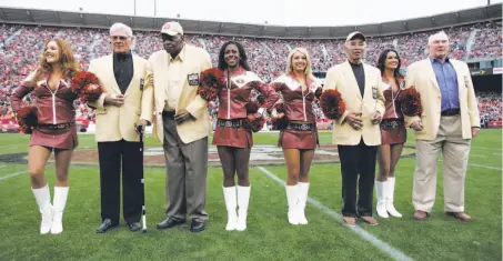  ?? Michael Zagaris / Getty Images 2007 ?? In 2007, the 49ers honored the “Million Dollar Backfield” at halftime of a game against the Rams at Candlestic­k Park. The players are Hugh McElhenny (first man on left), John Henry Johnson, Joe Perry and Y.A. Tittle.