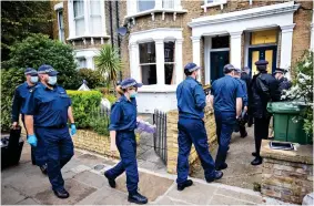  ?? ?? Search: Police enter the suspect’s house in north London