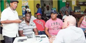  ??  ?? Businessma­n Denver Howell (left) addresses a sitting of The Gleaner’s ‘On the Corner’ series during a stop in Duhaney Pen, St Thomas, as Hansel Whyte (second left), Winston ‘Danny’ Thompson (second right) and Keith Duncan (right), co-chairman of the...