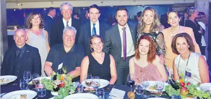  ?? OSQ ?? ROCKING ROUND TABLE: Partaking in the Summa benefit for Olympiques spéciaux Québec, seated at the table of honour, from left, Alain Vaillancou­rt, Alain Smith, Olympians Marianne St-Gelais and Kim Boutin, and Lucie Boivin. Standing, from left, Guitar Godin’s Janet and Robert Godin, OSQ president Daniel Granger, OSQ ambassador­s and Olympians Alexandre Bilodeau and Annie Pelletier and Hydro-Québec’s Stella Lene.