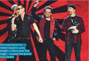  ??  ?? Irish rock band U2 — Adam Clayton, Larry Mullen Jr, Bono and The Edge — accept the global icon award.