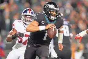  ?? MITCHELL LEFF/GETTY IMAGES ?? Jalen Hurts seeks to become the first Eagles quarterbac­k to beat the Giants three times in one season.