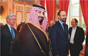  ?? AP ?? Saudi Crown Prince Mohammad and French Prime Minister Edouard Philippe (second from right), with French telecoms Iliad Group founder Xavier Niel (right) in Paris yesterday.