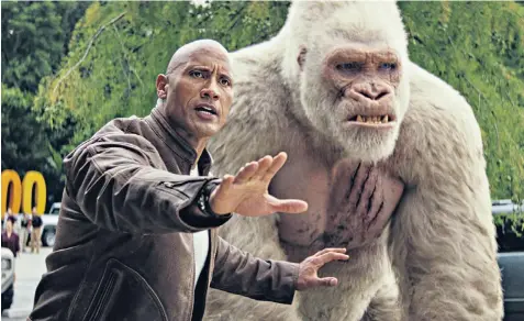  ??  ?? Gorilla war: Dwayne Johnson stars in Rampage, in which a giant gorilla destroys Chicago