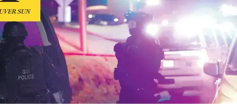  ?? FRANCIS VACHON / THE CANADIAN PRESS ?? Police monitor the scene of Sunday night’s shooting at a Quebec City mosque. Gunmen opened fire during evening prayers, killing five people.