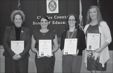  ?? PHOTO COURTESY OF CCPS ?? The Charles County Board of Education at its Oct. 9 meeting honored four employees for their dedication and commitment to teaching and learning. Honored were, from left, Elizabeth Adams, language arts teacher at General Smallwood Middle School; Natalie Wagner, fifth-grade teacher at William A. Diggs Elementary School; Sarah Kilikewich, reading recovery teacher at J.P. Ryon Elementary School; and Gwendolyn Todd, high school resource teacher at Thomas Stone High School.