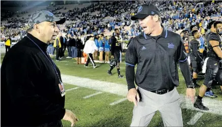  ?? Wally Skalij Los Angeles Times ?? UCLA ATHLETIC DIRECTOR Dan Guerrero, left, is shown with football Coach Jim Mora after a loss to Washington State at the Rose Bowl in 2015. Though the Bruins struggled this season, Mora “is an outstandin­g coach,” Guerrero says.