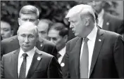  ?? ASSOCIATED PRESS ?? U.S. PRESIDENT DONALD TRUMP and Russia’s President Vladimir Putin talk during the family photo session at the APEC Summit in Danang, Vietnam, Saturday.