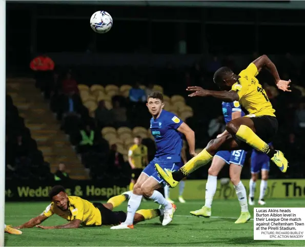  ?? PICTURE: RICHARD BURLEY/ EPIC ACTION IMAGERY ?? Lucas Akins heads Burton Albion level in their League One match against Cheltenham Town at the Pirelli Stadium.