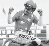  ?? Frank Franklin II / Associated Press ?? Mike Smith, 52, became the oldest jockey to win the Triple Crown after winning the Belmont Stakes.