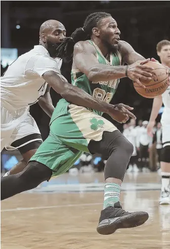  ?? AP PHOTO ?? DRIVE TO SUCCEED: Jae Crowder tries to get past the Nets’ Quincy Acy on hsi way to the hoop during the Celtics’ 98-95 victory last night in New York.