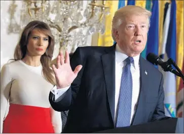  ?? Evan Vucci Associated Press ?? PRESIDENT TRUMP, pictured with Melania Trump in October, is expected to unveil some details of his opioid plan during his scheduled visit Monday to New Hampshire, which has been hit hard by the opioid crisis.