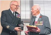  ?? Picture: PA. ?? Harry Johnson, right, is awarded France’s highest order of merit by Emmanuel Cocher of the French Consul General.