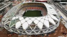  ?? BRUNO KELLY/REUTERS ?? Arena Amazonia stadium is under constructi­on to host World Cup games.