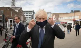  ?? Photograph: Stefan Rousseau/PA ?? Boris Johnson visiting his constituen­cy, Uxbridge in west London, last week, after announcing restrictio­ns ‘for perhaps six months’.