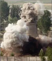  ?? XINHUA, GAO HAORONG — ASSOCIATED PRESS FILE PHOTO ?? In this June 27, 2008 file photo released by China’s Xinhua News Agency, the cooling tower of the Nyongbyon nuclear complex is demolished in Nyongbyon, also known as Yongbyon, North Korea.