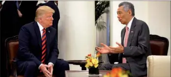  ?? MINISTRY OF COMMUNICAT­IONS AND INFORMATIO­N / HANDOUT VIA REUTERS SINGAPORE ?? US President Donald Trump meets with Singapore’s Prime Minister Lee Hsien Loong at the Istana in Singapore on Monday.