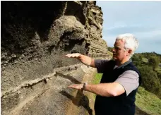  ??  ?? Warrnamboo­l geologist Derek Walters inside the crater at Tower Hill, formed when eruptions over the course of a few years built up different layers of volcanic rock.