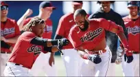  ?? RON SCHWANE — THE ASSOCIATED PRESS ?? Amed Rosario celebrates with Jose Ramirez after hitting the game-winning single.