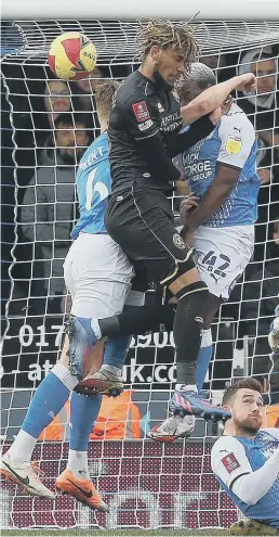  ?? ?? Posh defend a QPR corner.