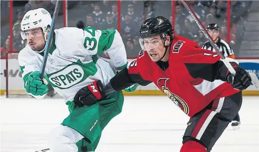  ?? ANDRE RINGUETTE GETTY IMAGES ?? Leaf Auston Matthews tries to break loose from Senators defenceman Cody Ceci in Saturday night’s game in Ottawa. Matthews managed nine shots on goal.