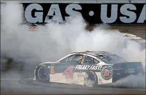  ?? AP/ISAAC BREKKEN ?? Kevin Harvick performs a burnout after winning the NASCAR Monster Energy Cup series Pennzoil 400 on Sunday in Las Vegas. Harvick, who won Feb. 25 at Atlanta, earned his 100th career victory across the three national series.